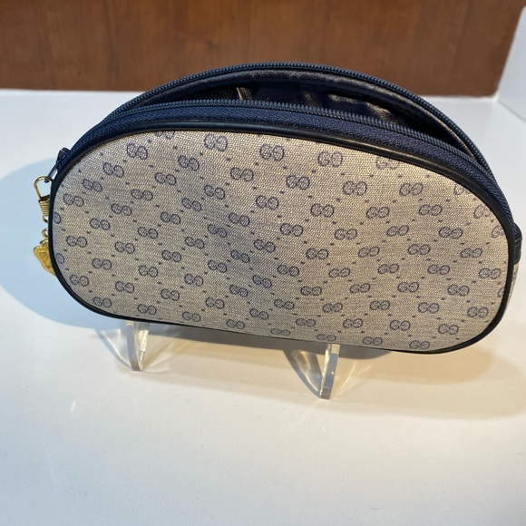 Gucci Handbags - Authentic 💯Gucci blue Monogram cosmetic Bag!